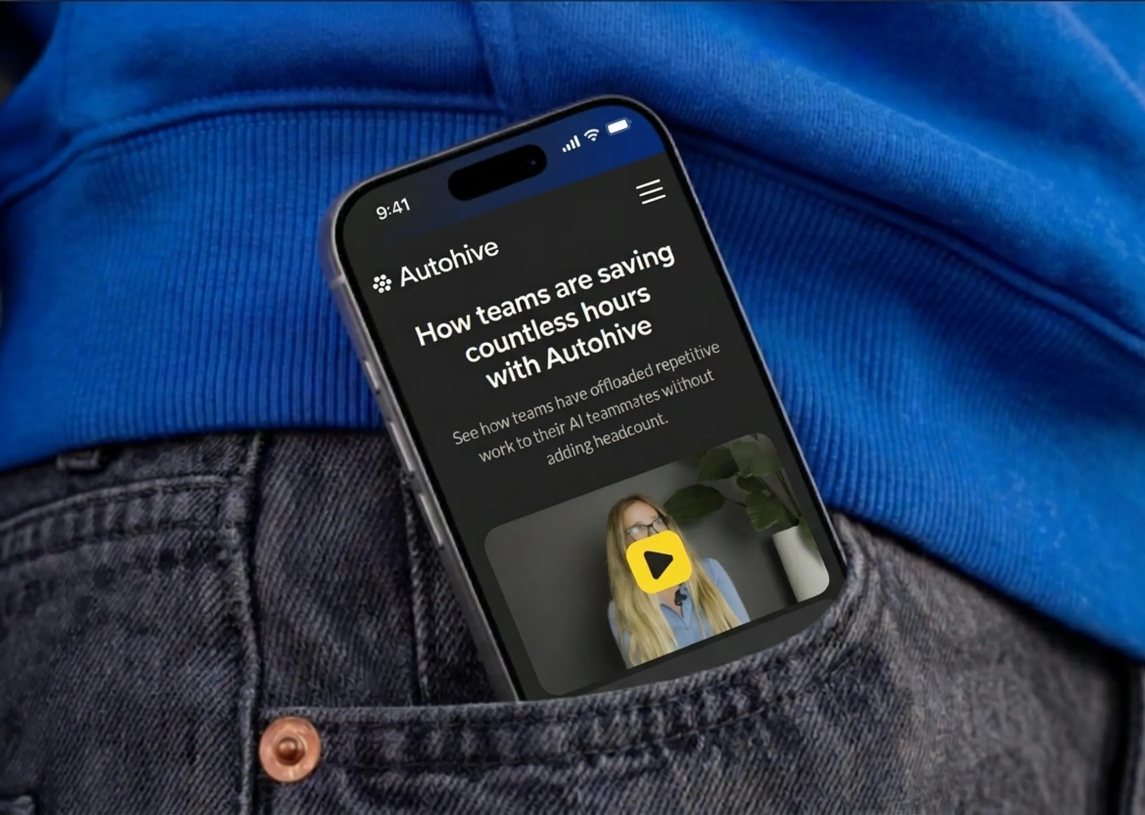 The Autohive site on a phone in a jacket pocket, open on how teams are saving hours with it.