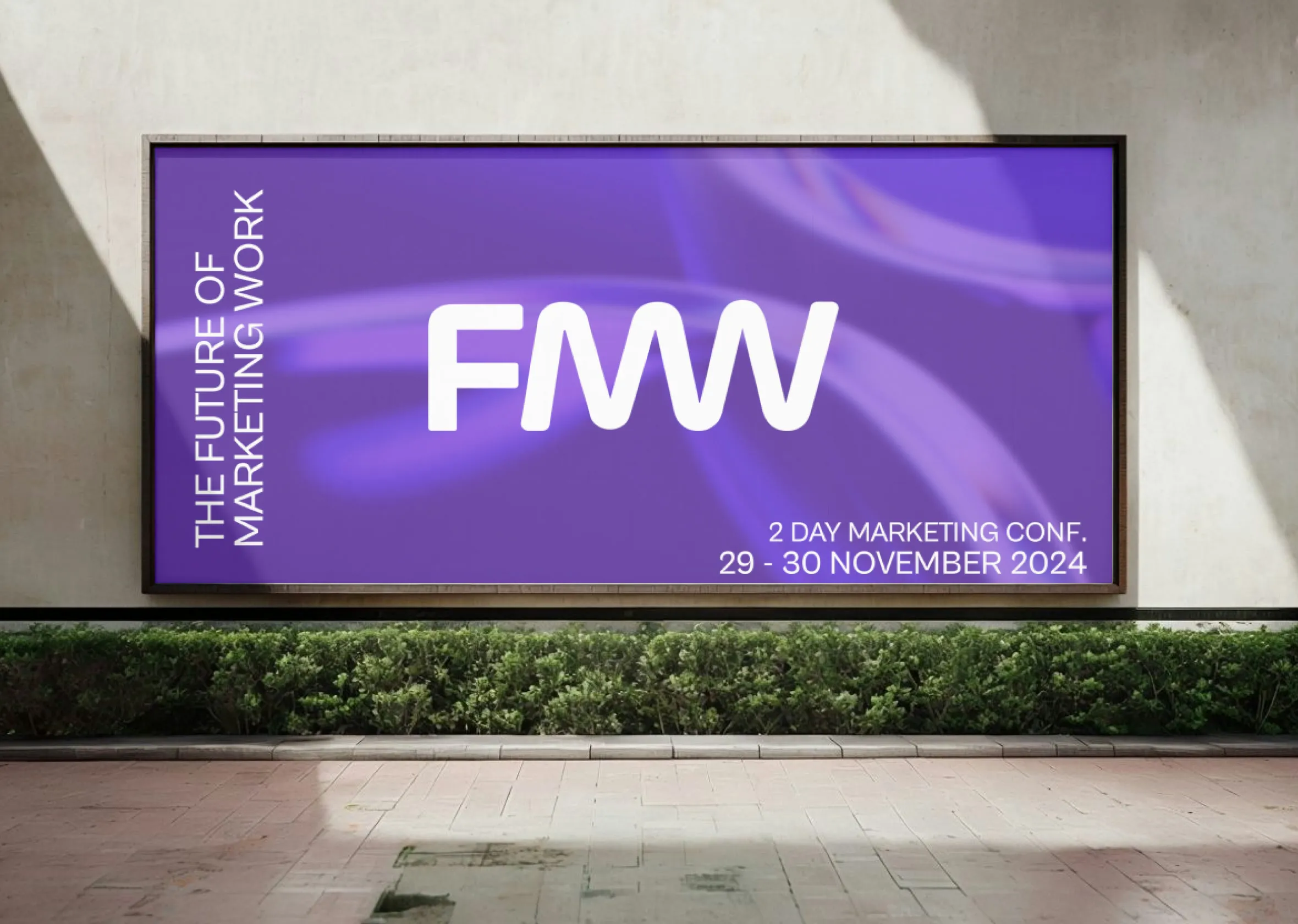 The conference title on a large screen in a room: two days, 29-30 November.